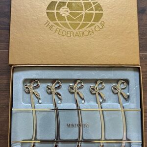 5-Mikimoto International featuring a pearl and ribbon design cocktail stirrer